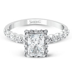 Featuring a delicate contemporary design, this brilliant white gold engagement ring is highlighted by .64 ctw of round cut white diamonds in an eye-catching geometric setting.