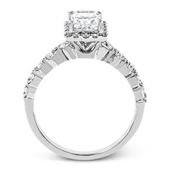 Featuring a delicate contemporary design, this brilliant white gold engagement ring is highlighted by .64 ctw of round cut white diamonds in an eye-catching geometric setting.