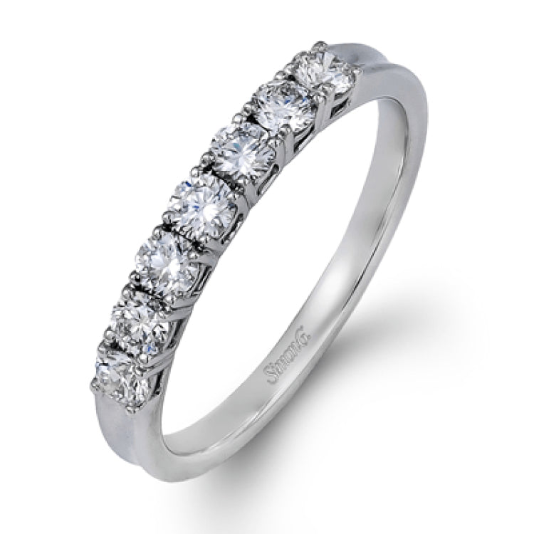 Elegantly simple, this classically styled white gold band is accented by the presence of .50 ctw of shimmering round cut white diamonds.