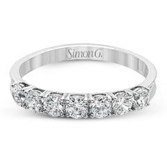 Elegant in its simplicity, this brilliant classically-styled platinum band is set with .75 ctw striking round cut white diamonds.