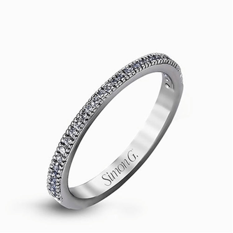 Featuring a contemporary take on a vintage style, this white gold engagement ring and band is complemented by .50 ctw of striking round cut white diamonds.