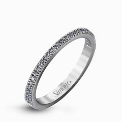 Featuring a contemporary take on a vintage style, this white gold engagement ring and band is complemented by .50 ctw of striking round cut white diamonds.