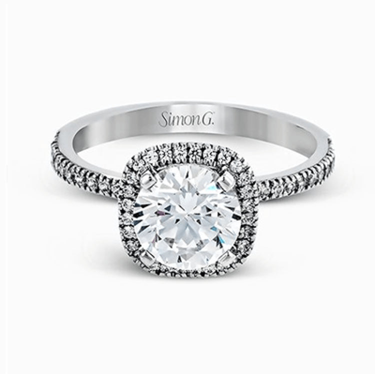 Featuring a contemporary take on a vintage style, this white gold engagement ring and band is complemented by .50 ctw of striking round cut white diamonds.