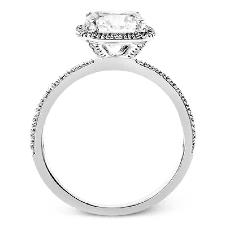 Featuring a contemporary take on a vintage style, this white gold engagement ring and band is complemented by .50 ctw of striking round cut white diamonds.