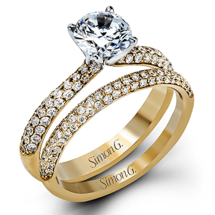 The classic design of this white gold engagement ring and wedding band set is emphasized by .72 ctw round cut white diamonds.