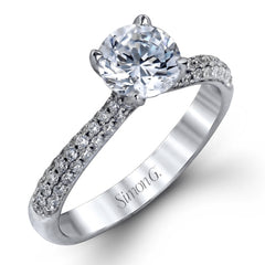 The classic design of this white gold engagement ring and wedding band set is emphasized by .72 ctw round cut white diamonds.