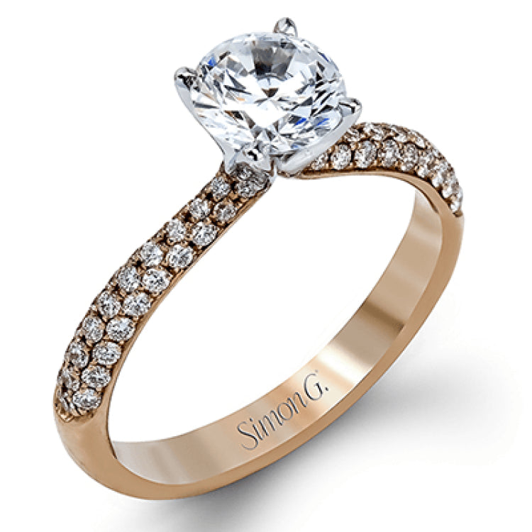 The classic design of this white gold engagement ring and wedding band set is emphasized by .72 ctw round cut white diamonds.