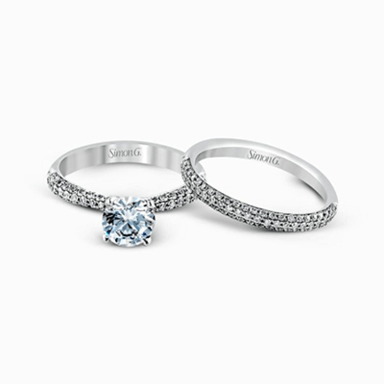 The classic design of this white gold engagement ring and wedding band set is emphasized by .72 ctw round cut white diamonds.