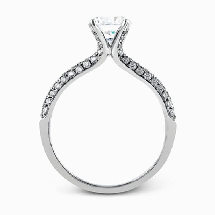 The classic design of this white gold engagement ring and wedding band set is emphasized by .72 ctw round cut white diamonds.