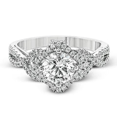 Set with .35 ctw of arresting round cut white diamonds, this lovely white gold engagement ring features a memorable intertwined design on the band.