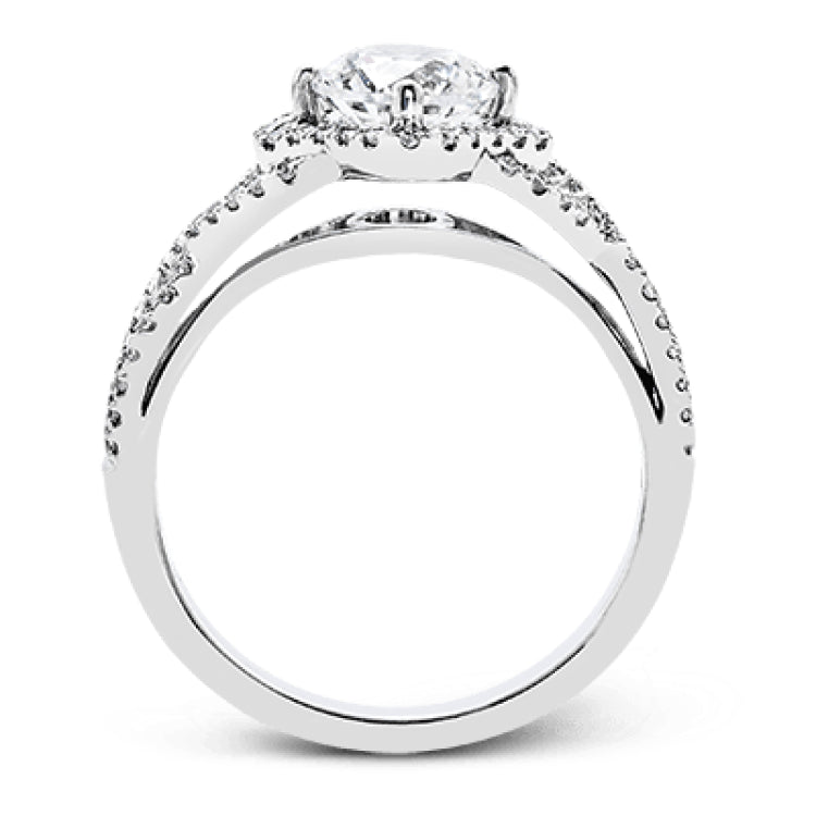 Set with .35 ctw of arresting round cut white diamonds, this lovely white gold engagement ring features a memorable intertwined design on the band.