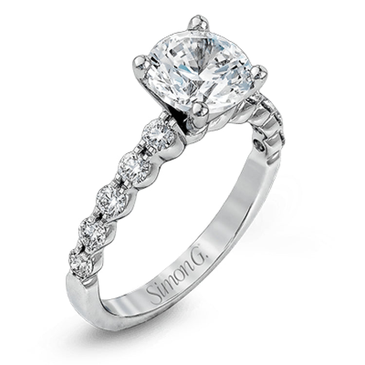 This marvelous white gold wedding set highlights its center stone with 1.19 ctw of round white diamond accents.
