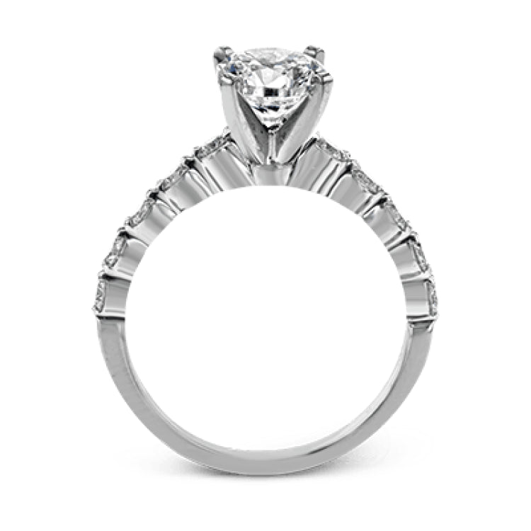 This marvelous white gold wedding set highlights its center stone with 1.19 ctw of round white diamond accents.