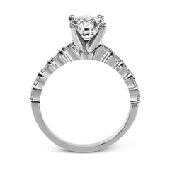 This marvelous white gold wedding set highlights its center stone with 1.19 ctw of round white diamond accents.