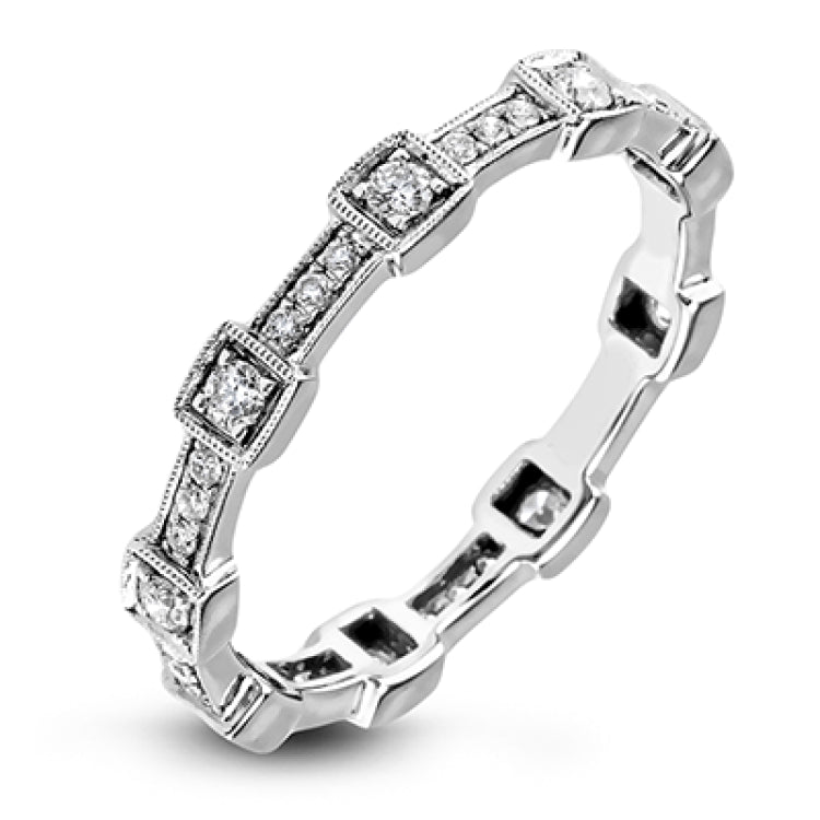 This white gold band form a modern style band set with .33 ctw of striking round cut white diamond accents. Perfect for stacking.