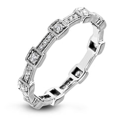 This white gold band form a modern style band set with .33 ctw of striking round cut white diamond accents. Perfect for stacking.