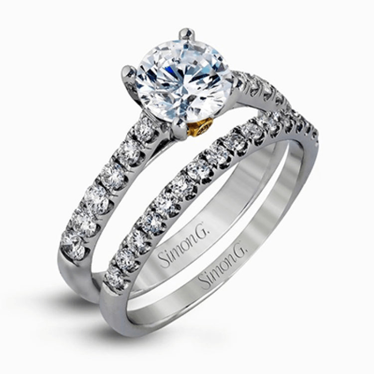 This charming contemporary two-tone wedding set is accented by .66 ctw of glistening round cut white diamonds with .02 ctw round cut yellow diamond accents.