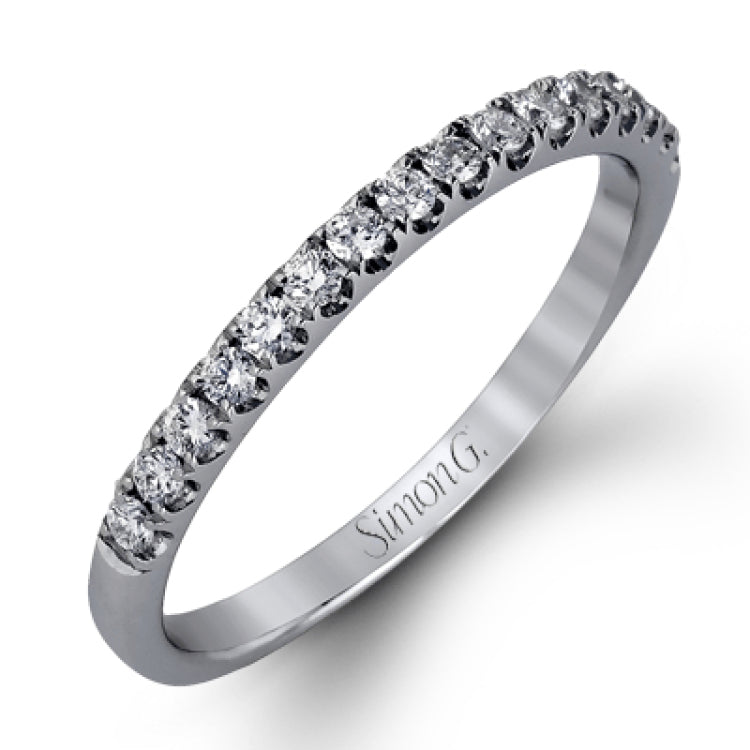 This charming contemporary two-tone wedding set is accented by .66 ctw of glistening round cut white diamonds with .02 ctw round cut yellow diamond accents.