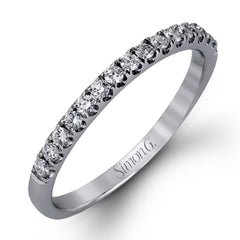 This charming contemporary two-tone wedding set is accented by .66 ctw of glistening round cut white diamonds with .02 ctw round cut yellow diamond accents.