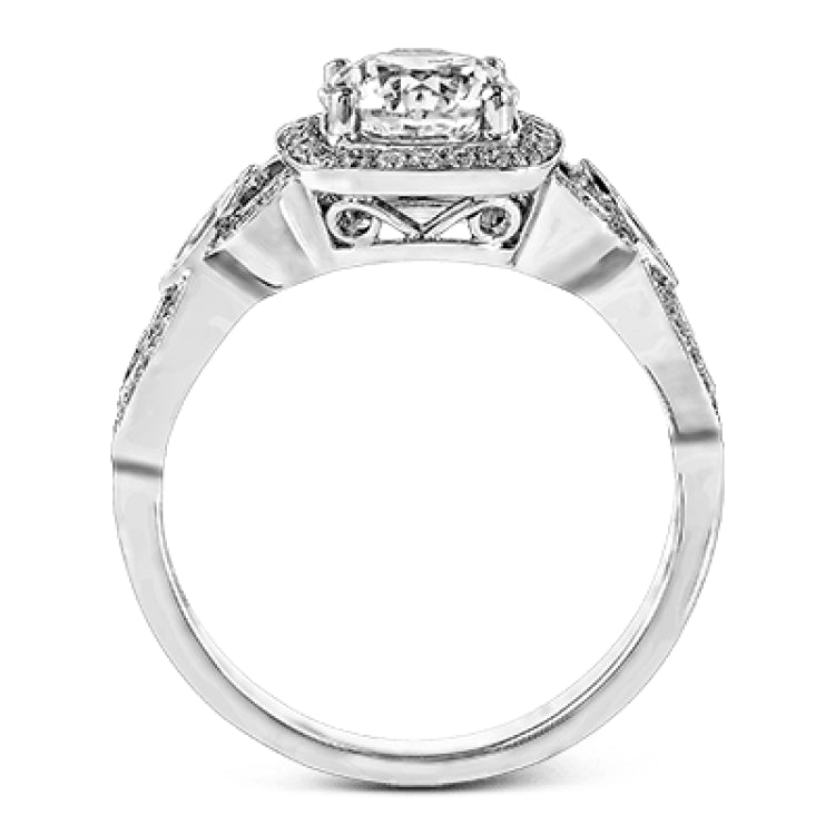 This impressive white gold engagement ring is accented by .23 ctw white round cut diamonds and .20 ctw marquise cut diamonds.