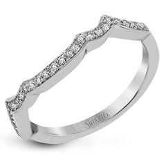 This impressive white gold engagement ring is accented by .23 ctw white round cut diamonds and .20 ctw marquise cut diamonds.