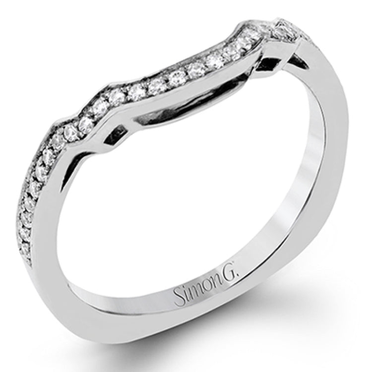 Featuring an impressive modern design, this white gold ring features .53 ctw emerald cut stone sides and .46 ctw round cut white diamonds.
