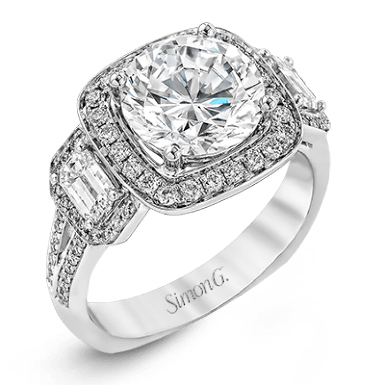 Featuring an impressive modern design, this white gold ring features .53 ctw emerald cut stone sides and .46 ctw round cut white diamonds.