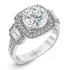 Featuring an impressive modern design, this white gold ring features .53 ctw emerald cut stone sides and .46 ctw round cut white diamonds.