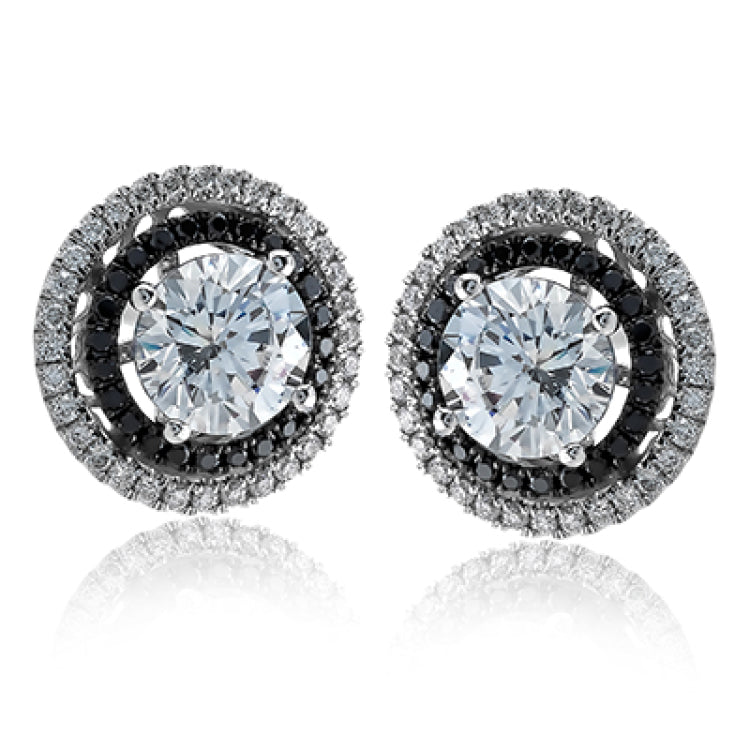 These earring jackets make for a stud earrings provide a touch of rose gold and white gold in a double halo design. These contain .50 ctw of white diamonds.