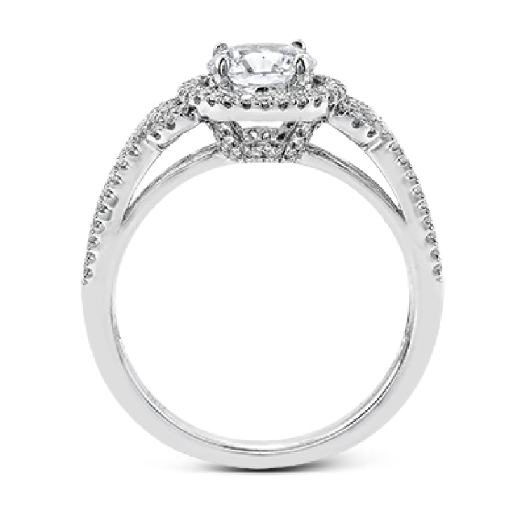 This 18k white gold ring contains .30 ctw of side diamonds set within its classic halo design.
