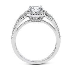 This 18k white gold ring contains .30 ctw of side diamonds set within its classic halo design.