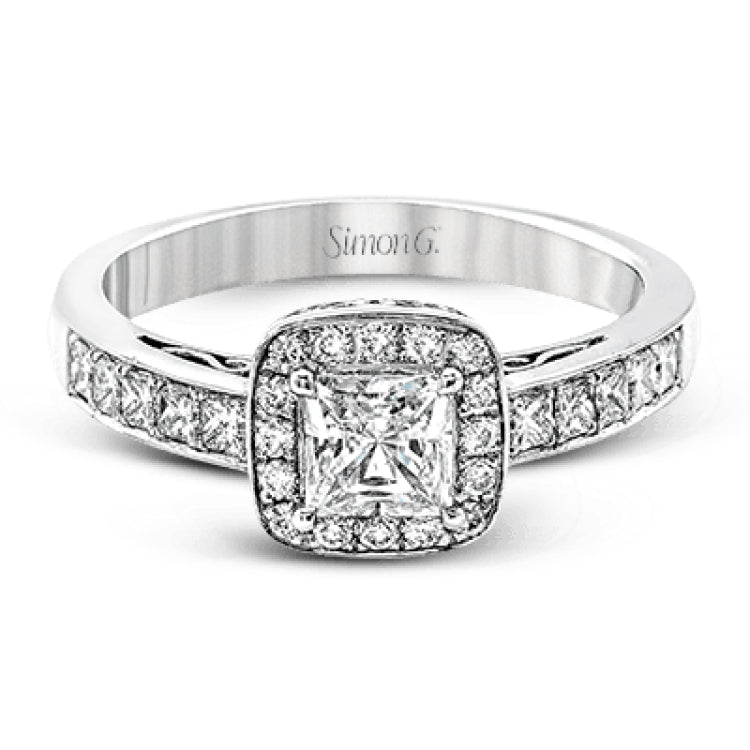 This lovely contemporary white gold engagement ring is set with .34 ctw of glistening princess cut white diamonds and .13 ctw of round cut white diamonds.