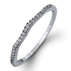 Featuring a modern design, this rose and white gold engagement ring and wedding band is highlighted by .51 ctw of round cut white diamonds.