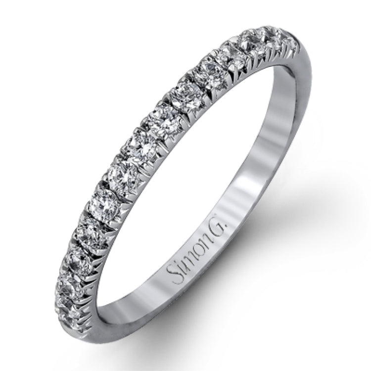 The classic halo design of this white gold engagement ring and wedding band are elevated by .80 ctw of shimmering round cut white diamonds.