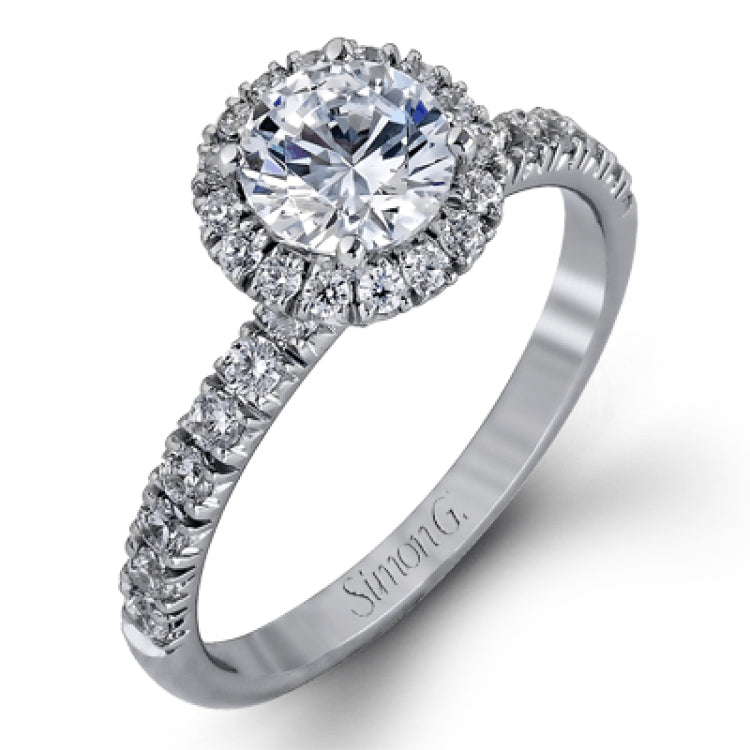The classic halo design of this white gold engagement ring and wedding band are elevated by .80 ctw of shimmering round cut white diamonds.