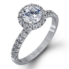 The classic halo design of this white gold engagement ring and wedding band are elevated by .80 ctw of shimmering round cut white diamonds.