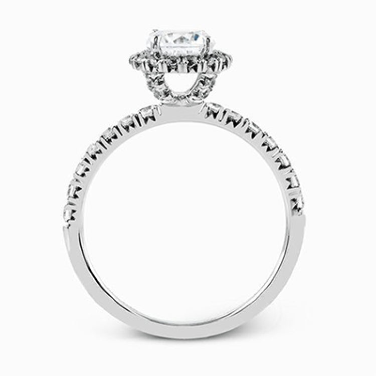 The classic halo design of this white gold engagement ring and wedding band are elevated by .80 ctw of shimmering round cut white diamonds.