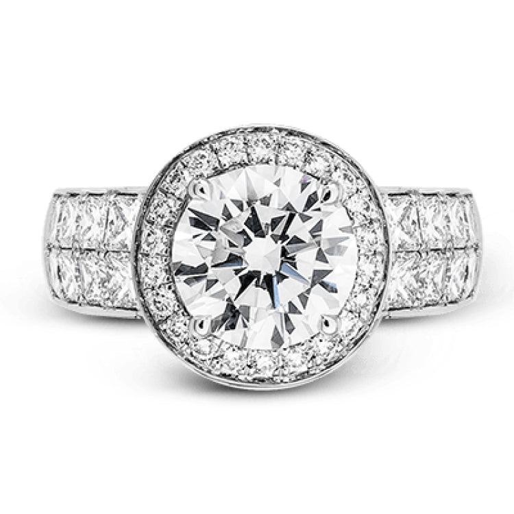 With a beautiful halo surrounding the center stone, this lovely white gold engagement ring is set with 1.14 ctw of shimmering princess cut white diamonds and .20 ctw round cut white diamonds.