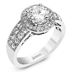 With a beautiful halo surrounding the center stone, this lovely white gold engagement ring is set with 1.14 ctw of shimmering princess cut white diamonds and .20 ctw round cut white diamonds.
