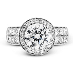 With a beautiful halo surrounding the center stone, this lovely white gold engagement ring is set with 1.14 ctw of shimmering princess cut white diamonds and .20 ctw round cut white diamonds.