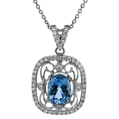 This lovely vintage inspired three-tone pendant features an intricate lacy design set with .38 ctw round cut white diamonds and .45 ctw yellow oval diamonds.