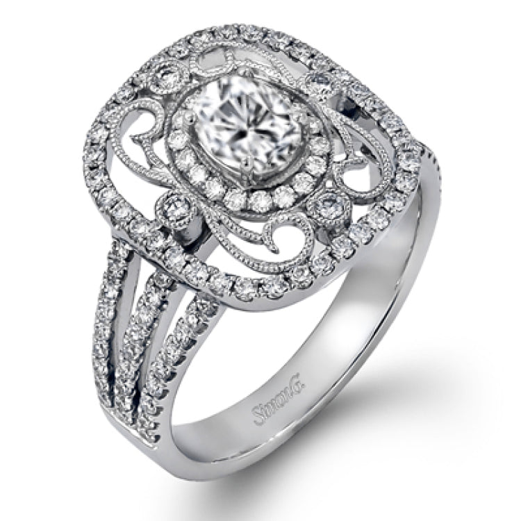 Reflecting an intricate vintage-inspired design, this three-tone gold ring is set with .61 ctw round cut white diamonds and a .53 ctw yellow oval diamond.