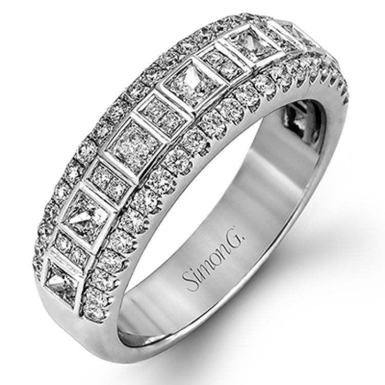 These stunning 18k white gold band contains .93 ctw of princess cut white diamonds as well as .44 ctw of round white diamonds.