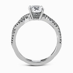 The intricate twisted design of this modern white gold engagement ring and wedding band set is set with .65 ctw of striking round cut white diamonds.