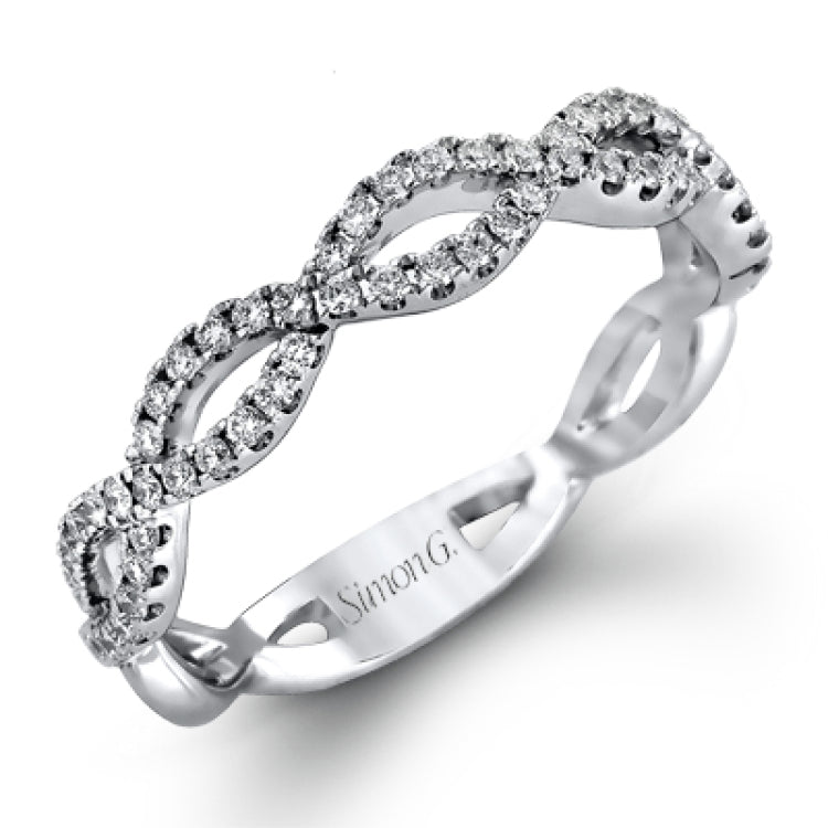 The intricate twisted design of this modern white gold engagement ring and wedding band set is set with .65 ctw of striking round cut white diamonds.