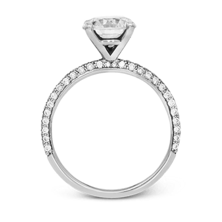 Presenting an eye-catching modern design, this white gold engagement ring and wedding band are highlighted by 1.45 ctw of round cut white diamonds.