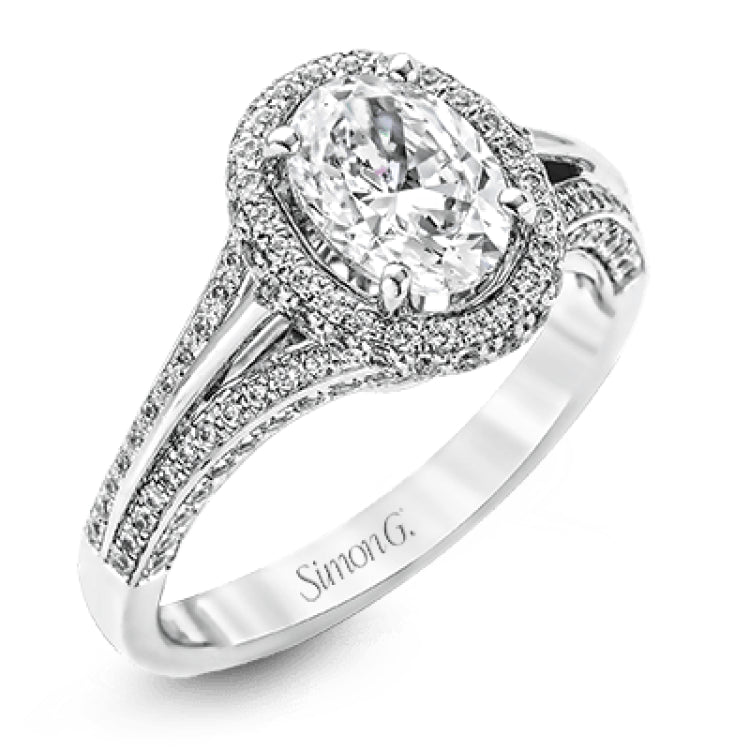 This lovely 18k white gold engagement ring design is created for an elegant oval center stone and features .77 ctw of white diamonds accented by a small touch of .03 ctw of yellow diamonds.