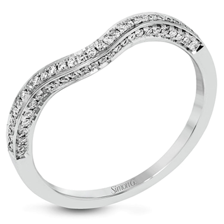This lovely 18k white gold engagement ring design is created for an elegant oval center stone and features .77 ctw of white diamonds accented by a small touch of .03 ctw of yellow diamonds.