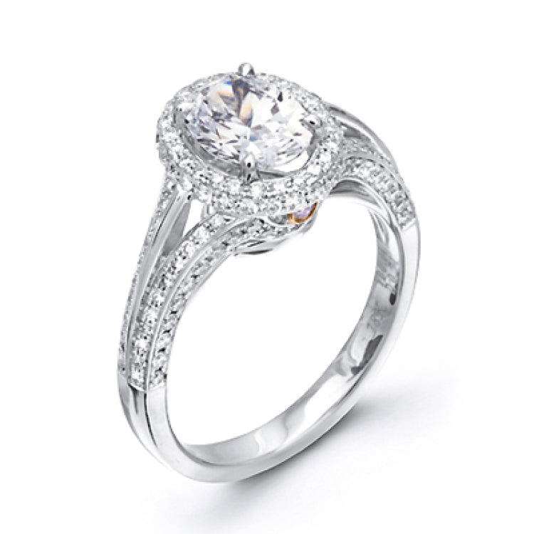 This lovely 18k white gold engagement ring design is created for an elegant oval center stone and features .77 ctw of white diamonds accented by a small touch of .03 ctw of yellow diamonds.