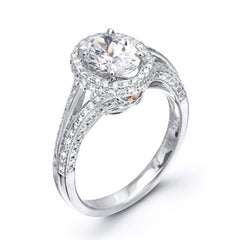This lovely 18k white gold engagement ring design is created for an elegant oval center stone and features .77 ctw of white diamonds accented by a small touch of .03 ctw of yellow diamonds.